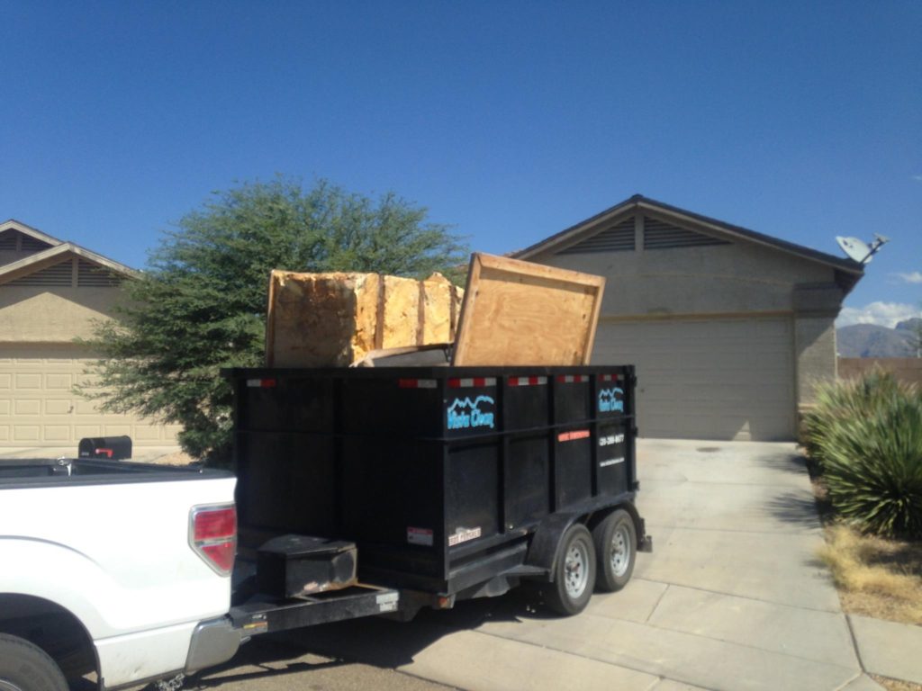 A trailer with a large wooden box on it.
