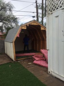 removing the insulation from the storage building