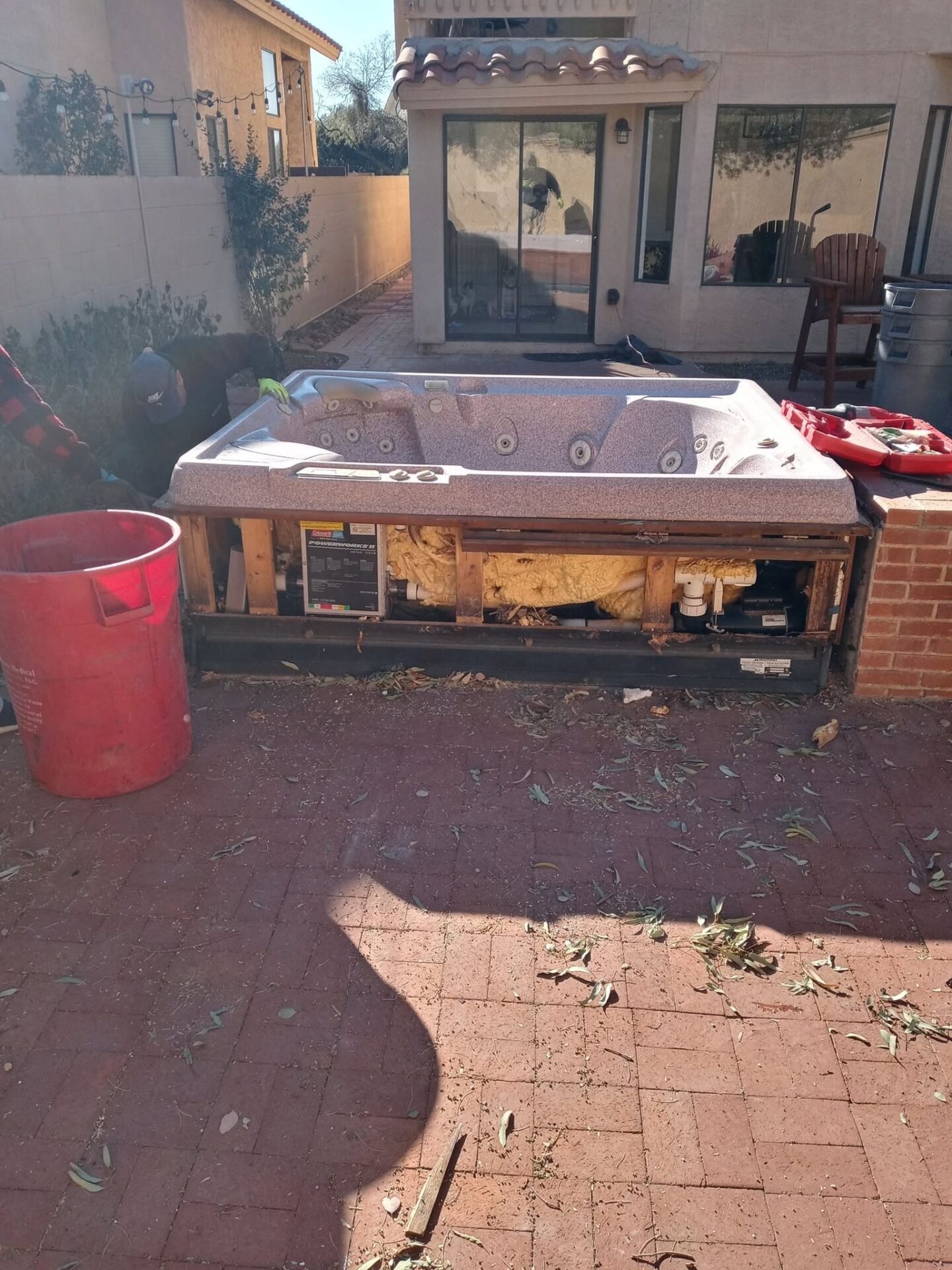 A before photo of a backyard in Tucson, AZ with a hot tub