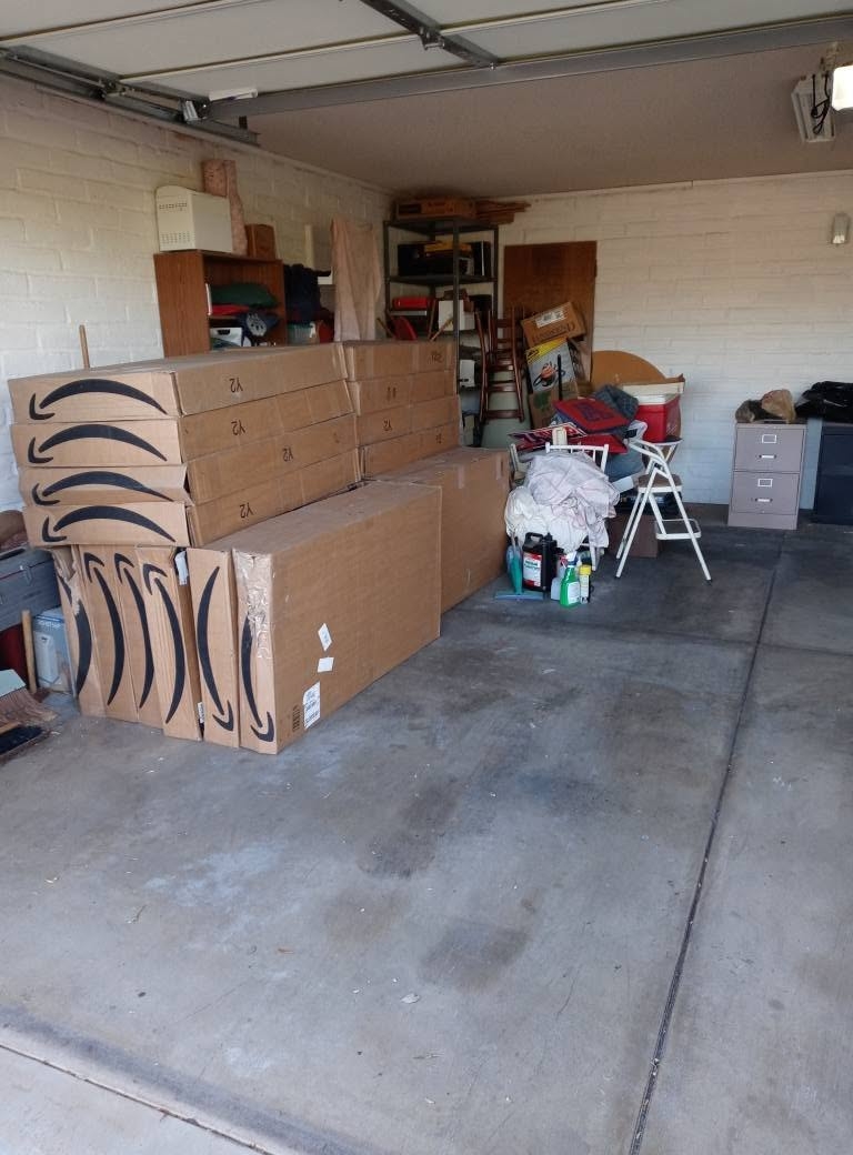 Photo of a garage in Vail, AZ full of boxes and aa bunch of other items