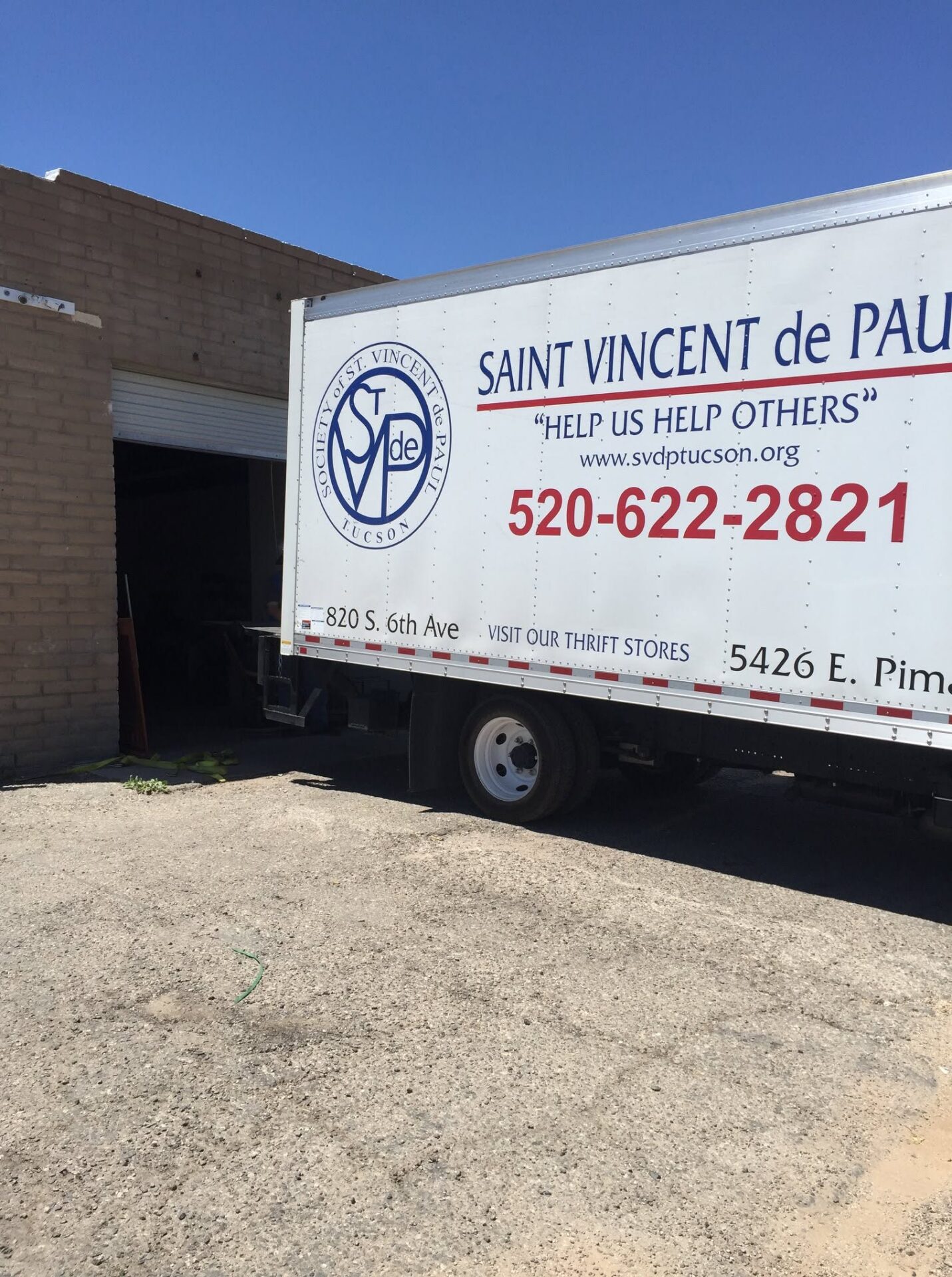 Saint Vincent de Paul donation truck picking up items at Vista Clean warehouse in Tucson