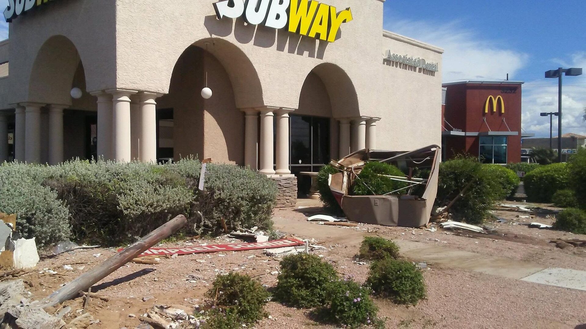 Before photo of storm debris cleanup outside Subway restaurant in Tucson